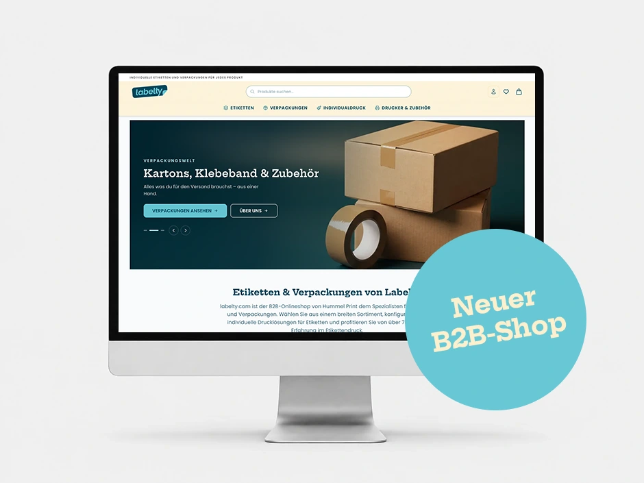 Monitor mit der Startseite von labelty.com und einem Störer „Neuer B2B-Shop“